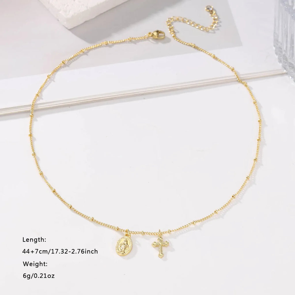 Gold Virgin Mary cross necklace with geometric pendant design for women