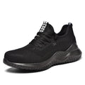 Black low-cut steel toe safety shoes with anti-static EVA sole on a work surface