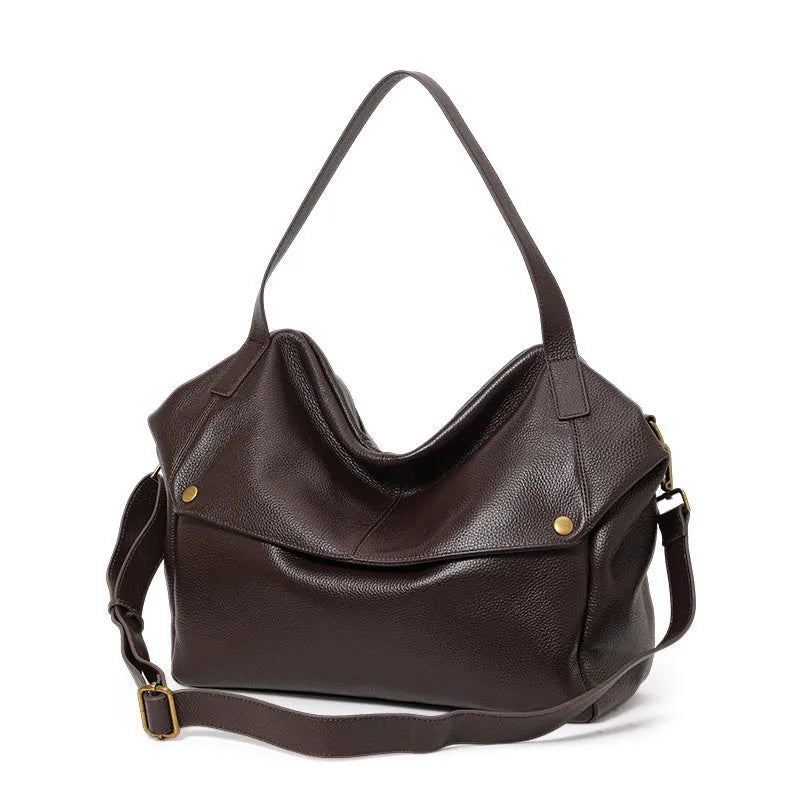Brown genuine leather women's commuter shoulder bag with horizontal square shape showing interior zipper change pocket