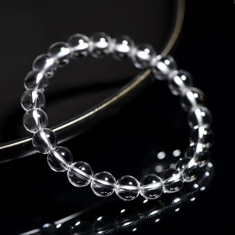 Natural Donghai Old Mine white crystal round bead bracelet on a wrist, showing geometric single circle design.
