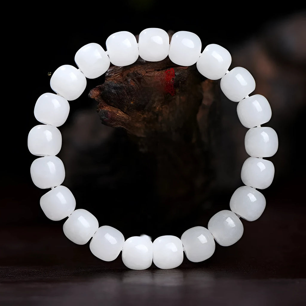 White Hetian jade barrel bead bracelet showing smooth pale stone beads in uniform barrel shape