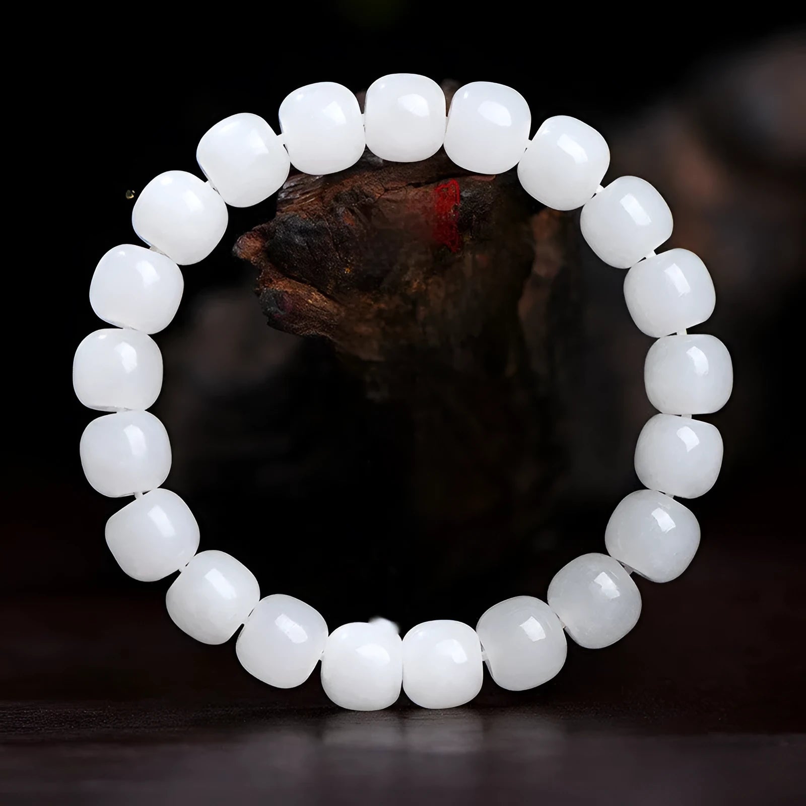 White Hetian jade barrel bead bracelet showing smooth pale stone beads in uniform barrel shape