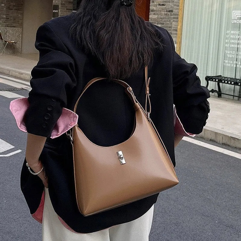 Genuine leather crossbody shoulder bag in dumpling shape with internal organiser compartments