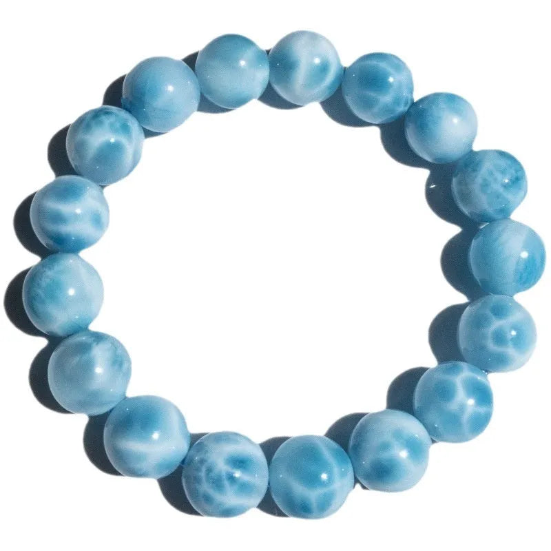 Blue handmade Bodhi bead bracelet with crystal sea-pattern stone and pearl accent on wrist