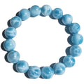 Blue handmade Bodhi bead bracelet with crystal sea-pattern stone and pearl accent on wrist