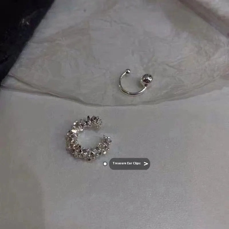 A pair of geometric irregular-shaped alloy earrings with a frosty finish and clip-on fastenings.
