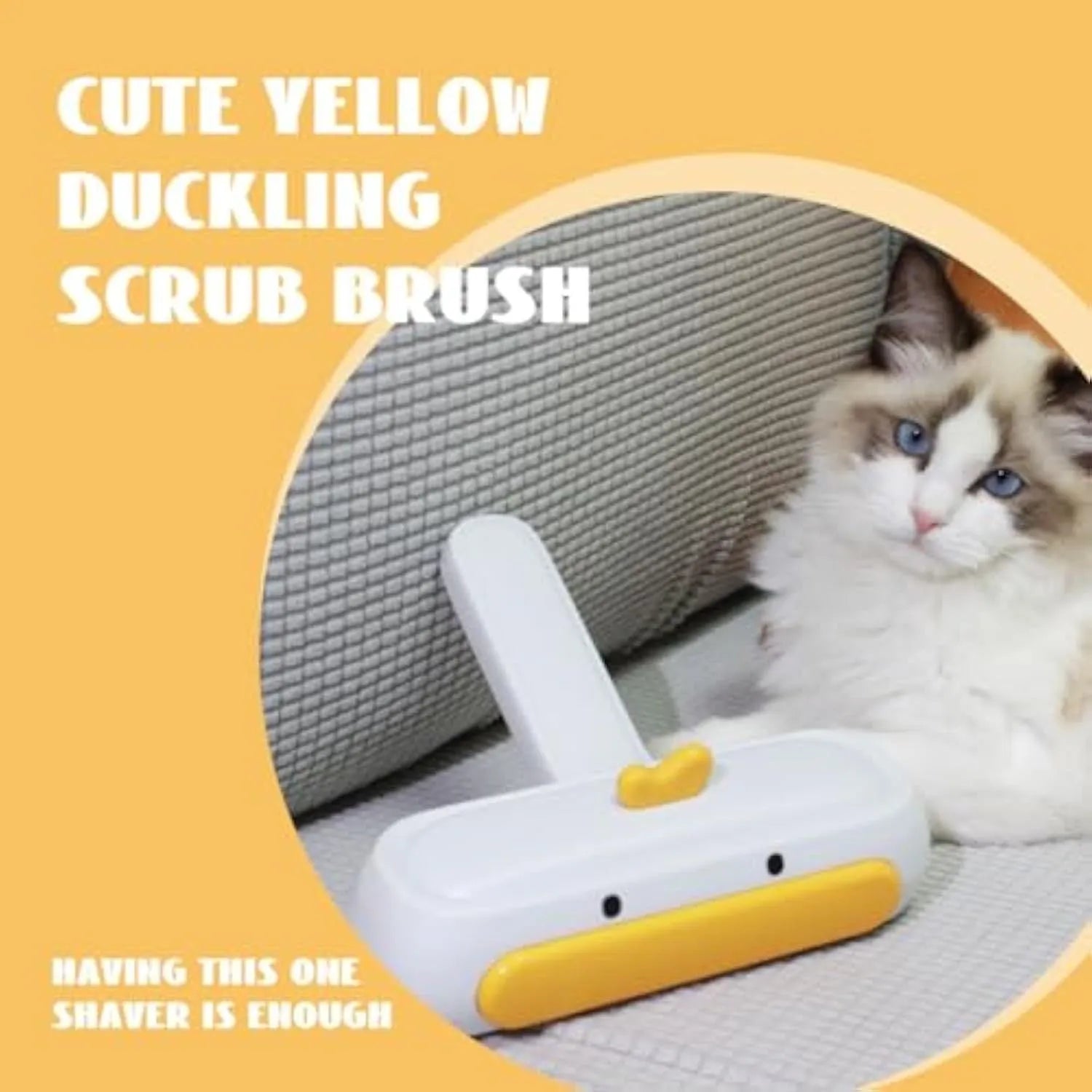 Yellow duck design portable manual pet hair remover tool on a fabric surface.