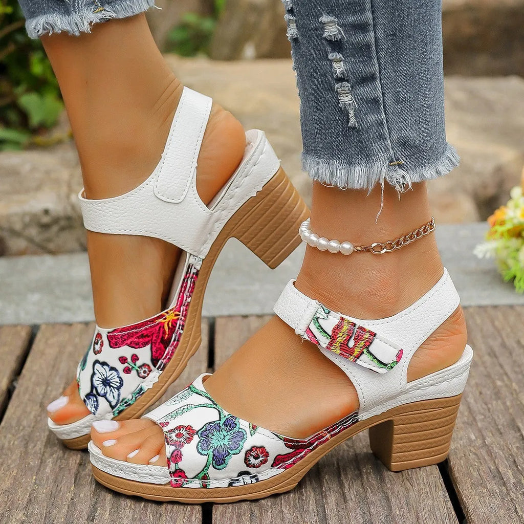 White women's high heel sandals with adjustable Velcro buckle strap on a casual rubber sole.