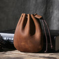Genuine cowhide leather drawstring bundle wallet in retro style, shown in black.