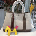 Women's genuine leather and canvas bucket tote bag with crossbody strap in black, brown, grey, or red colours