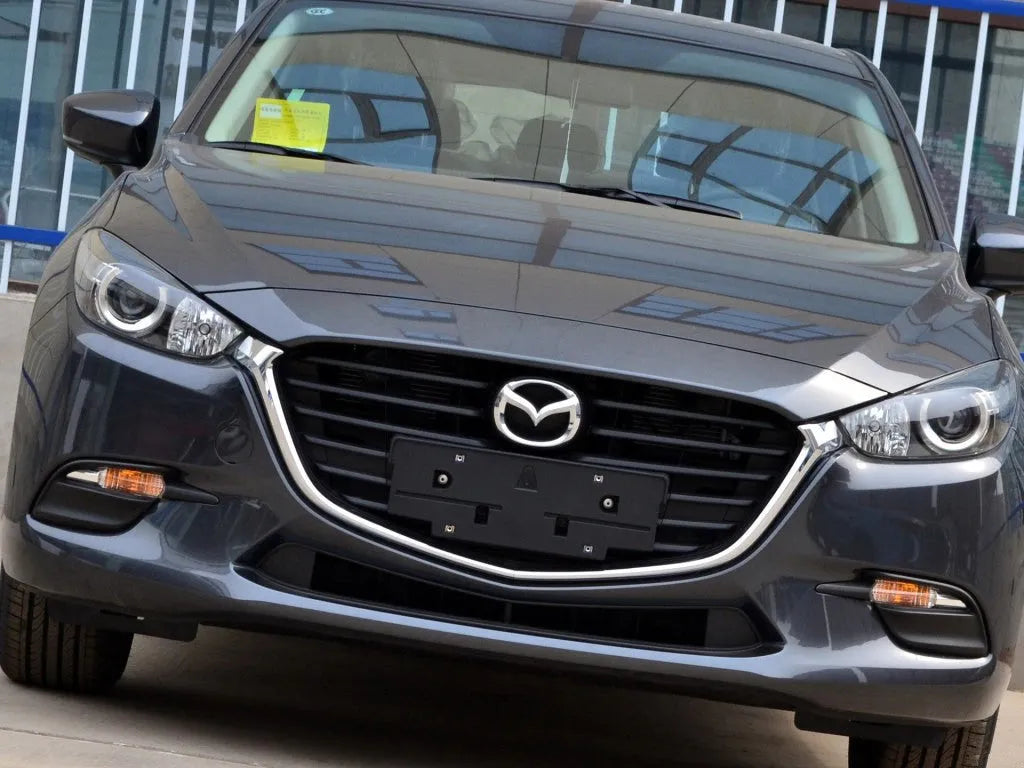 Mazda 3 Exela car headlamp cover replacement part with tube of snake glue adhesive.