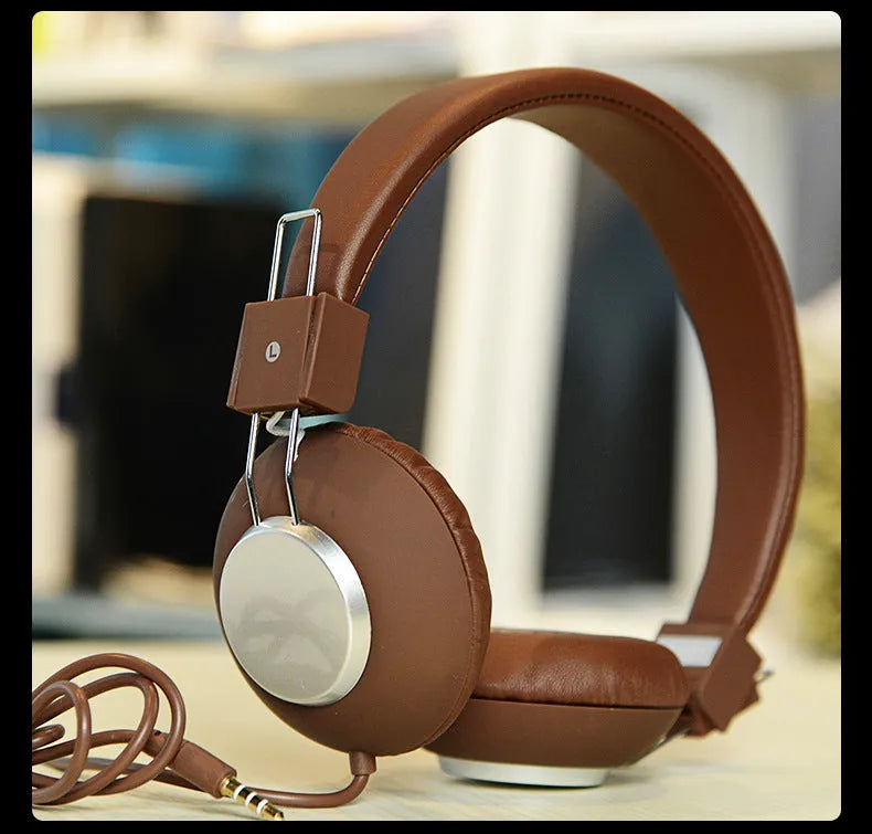 Wired head-mounted sports earphones with over-ear hooks and a 3.5mm plug, shown in multiple colours.