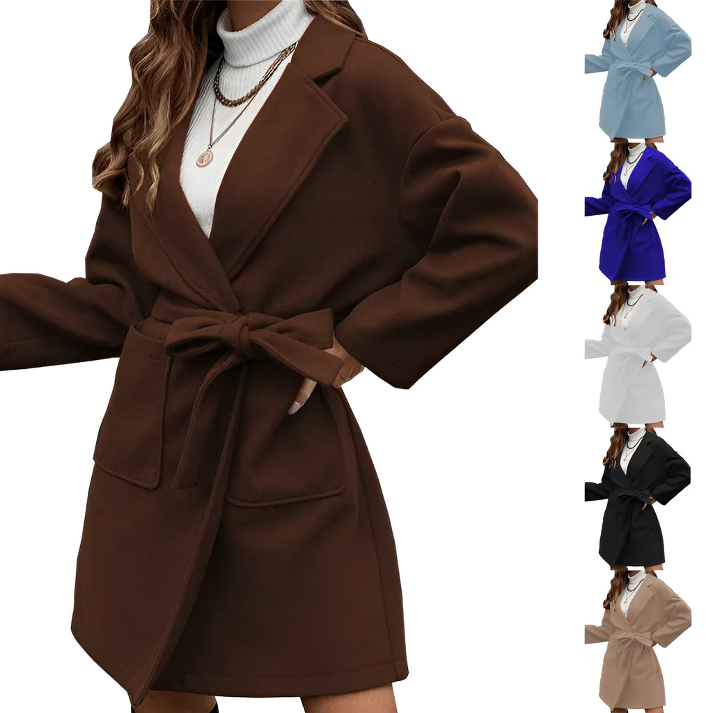Minimalist long sleeve lapel button coat in a light blue colour, featuring a split belt and a loose casual fit.