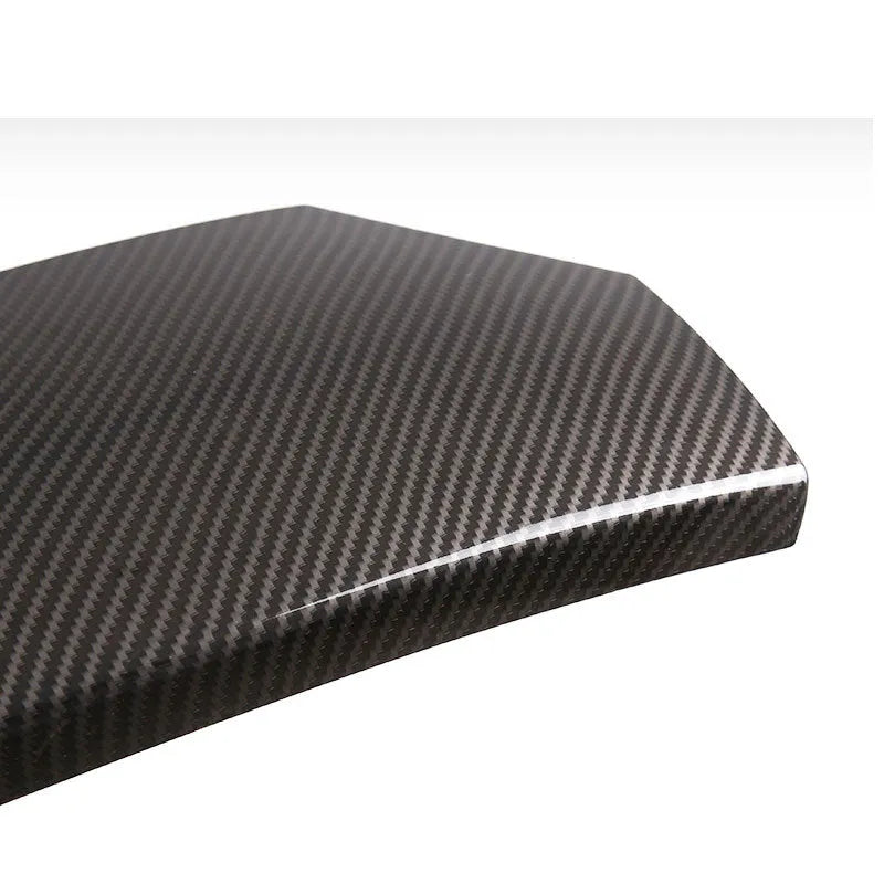 Three-piece set of black ABS armrest box protective covers with shiny carbon fibre pattern for car centre console.