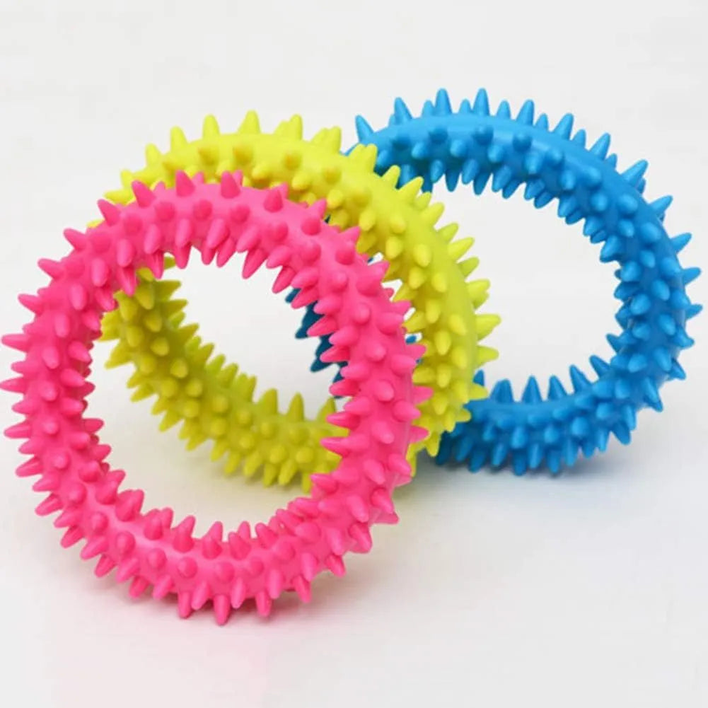 TPR spiky circle ring dog chew toy in various colours showing textured dental cleaning nubs