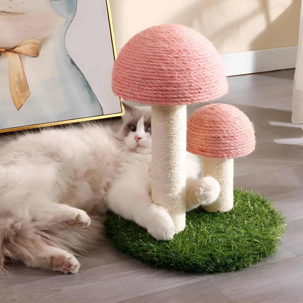 Pink mushroom-shaped cat scratching post with natural sisal caps and pole on a sturdy base.