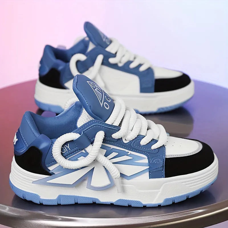 Men's white chunky sneakers with thick rubber sole, cartoon totem patterns, and lace-up front.