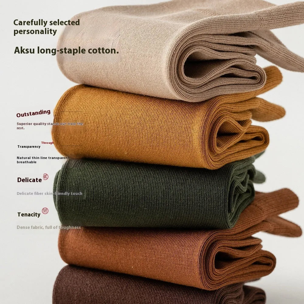 A pair of men's solid colour mid-calf socks made from combed cotton for business wear.