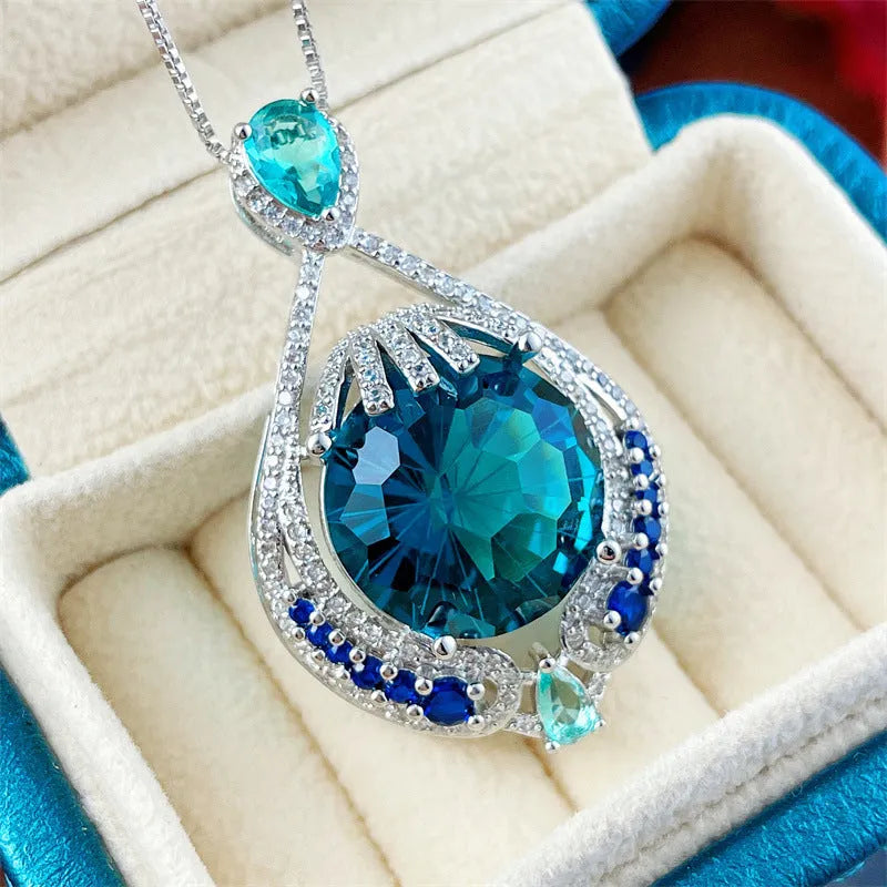 Blue geometric pendant necklace with fireworks-cut crystals on water wave chain