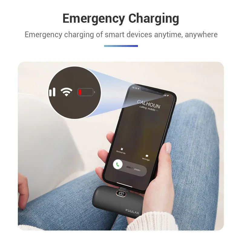 Cylindrical capsule power bank with built-in charging cable in black, white, or purple.