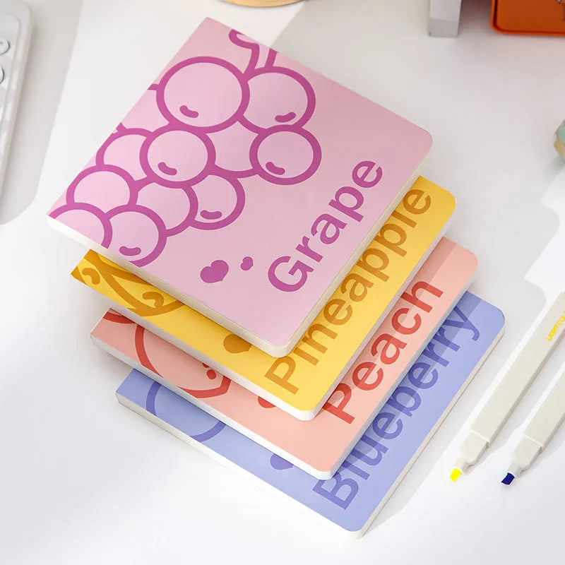 Square notebook with fruit-embossed cover showing pineapple, blueberry, grape, or peach designs, sized 14.5 cm