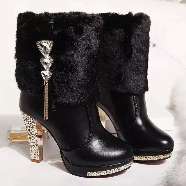 Women's black ankle boot with a chunky high heel on a white background, showing side profile.