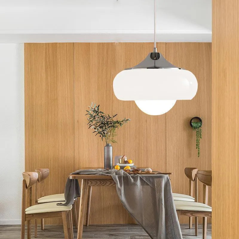 Bauhaus style three headed egg tart pendant light with glass shades in milky white finish