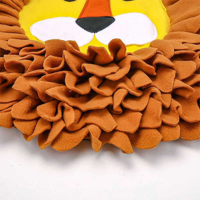 Brown lion-shaped sniffing pad pet toy for dogs and cats on a floor.