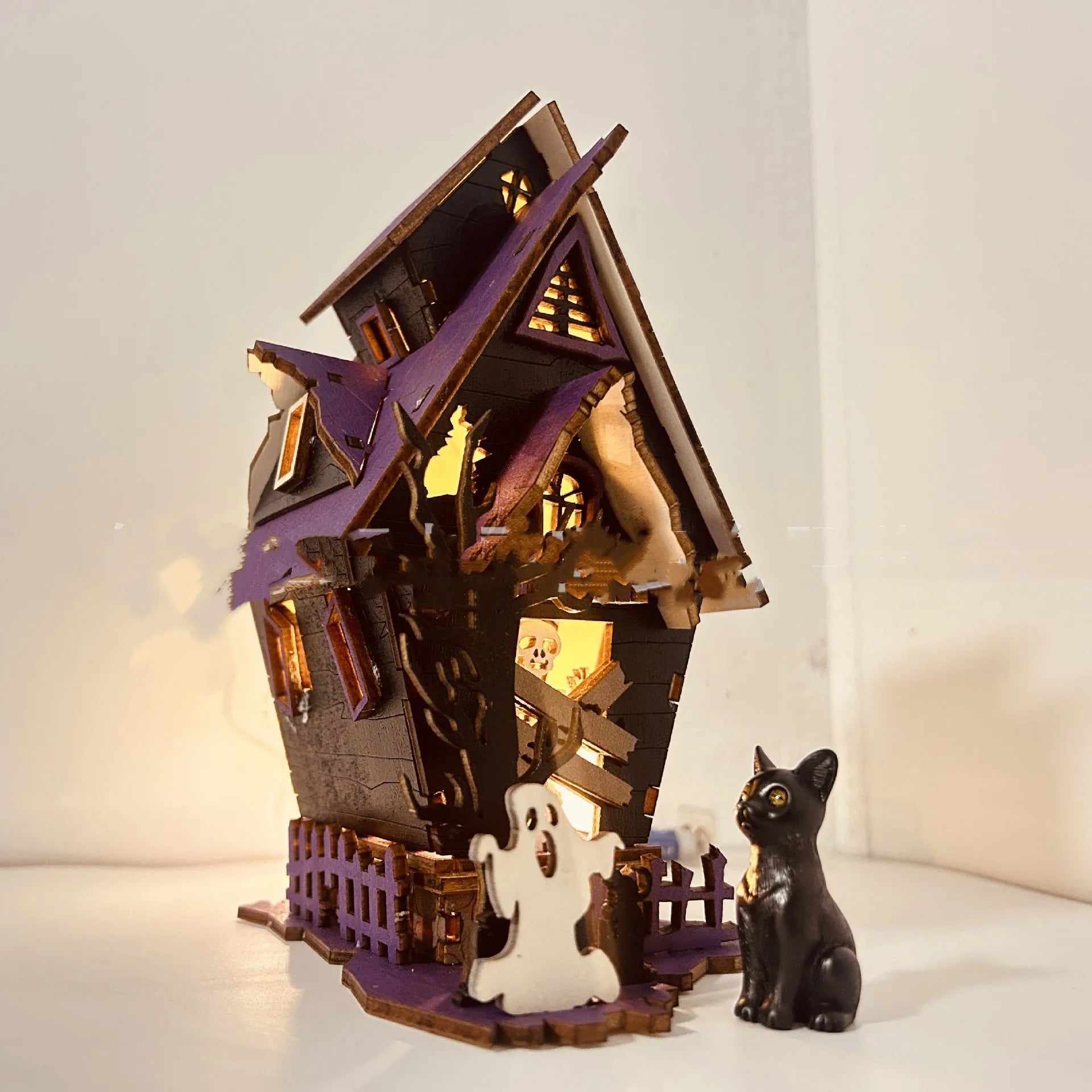Unlit wooden DIY haunted house decoration measuring 14x10.5x19cm for Halloween table display