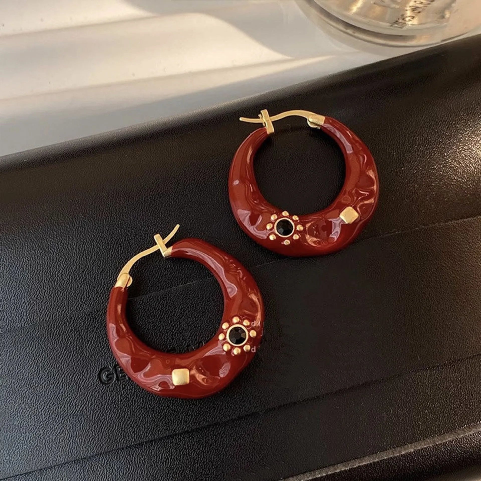 Hong Kong style retro ear studs with rhinestone detailing in black and red colour options