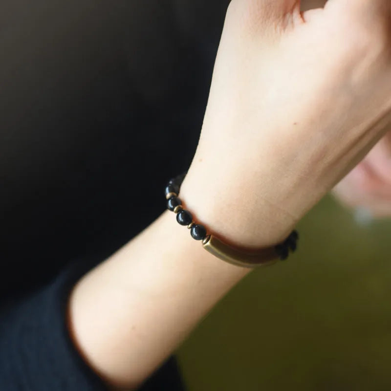 Layered retro ethnic bracelet with agate beads and brass accents showing colour options