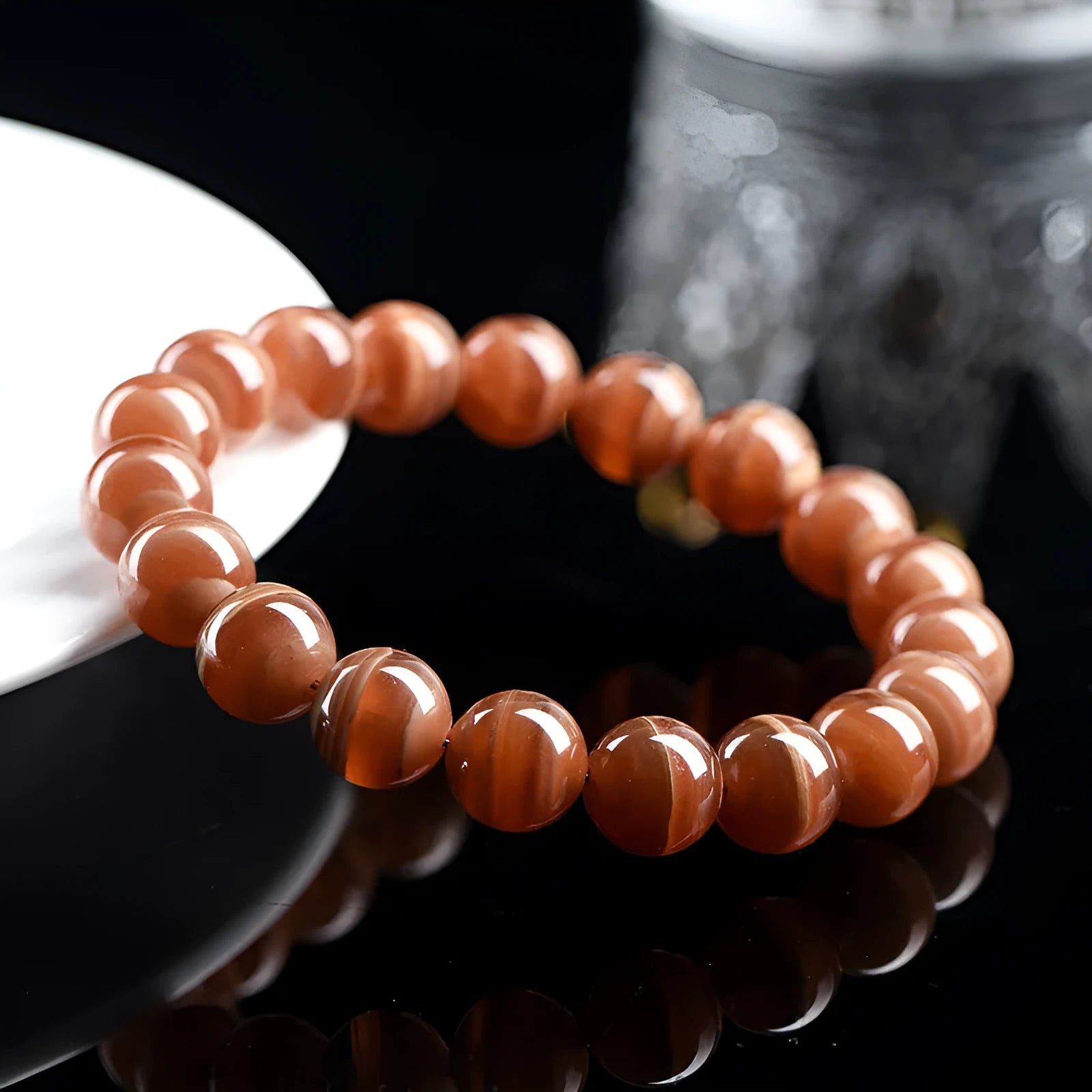 Natural Old Mine rhodochrosite mineral bracelet with round manganese spar beads in geometric design.