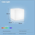 White square LED cube garden light stool with modern design, shown outdoors.