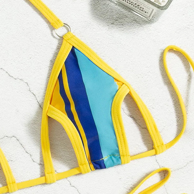 Yellow women's split swimsuit with neck-hanging style, backless hollow design, and high-waist shorts.