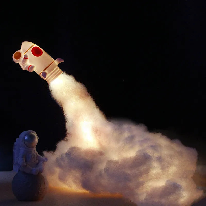 DIY astronaut rocket night light kit parts including plastic rocket, LED string, straws, and 19cm base