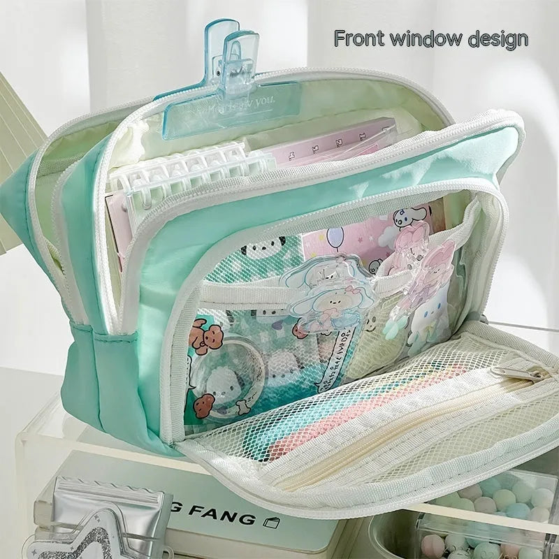 Double layer high-capacity pencil case in solid colour with gift handle, shown open to reveal two compartments.