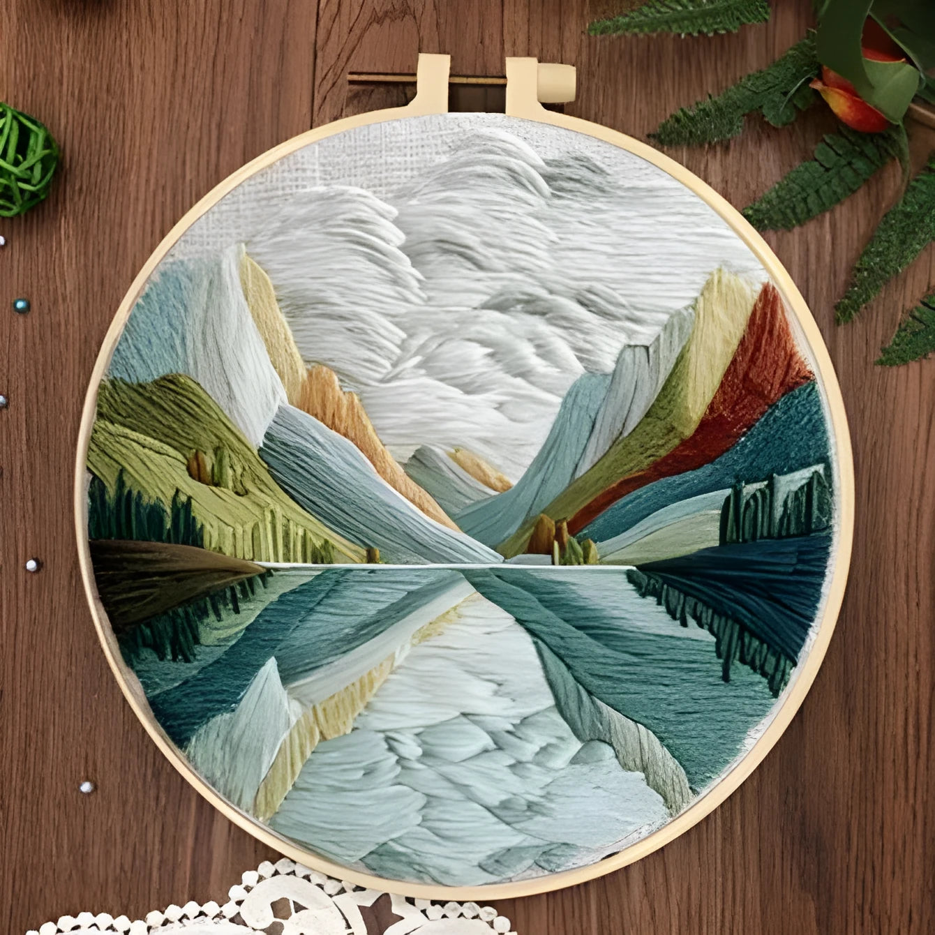 Embroidery DIY kit with landscape printed fabric, bamboo frame, thread, and needles for handmade cloth art