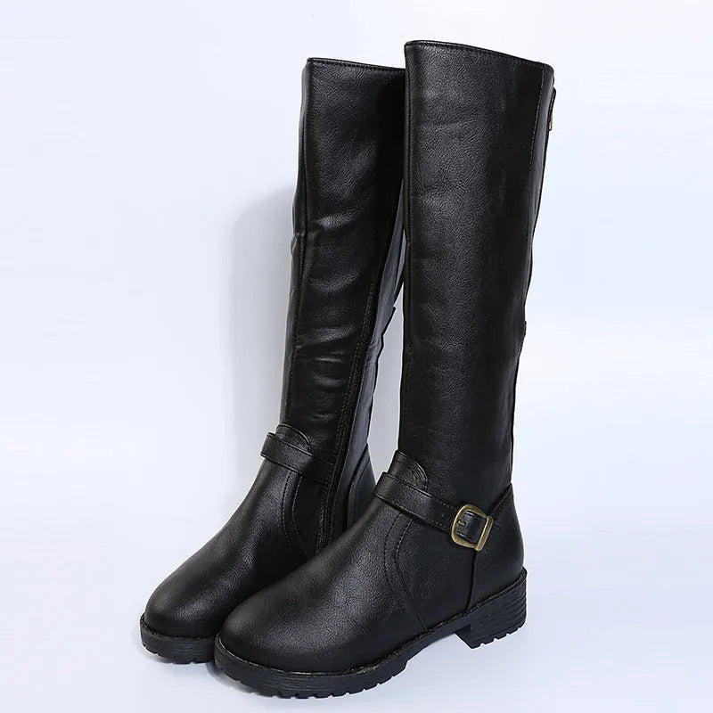 Women's black knight boots with belt buckle details and square heel on model