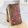 Embossed floral Chinese style handbag in black with zipper closure