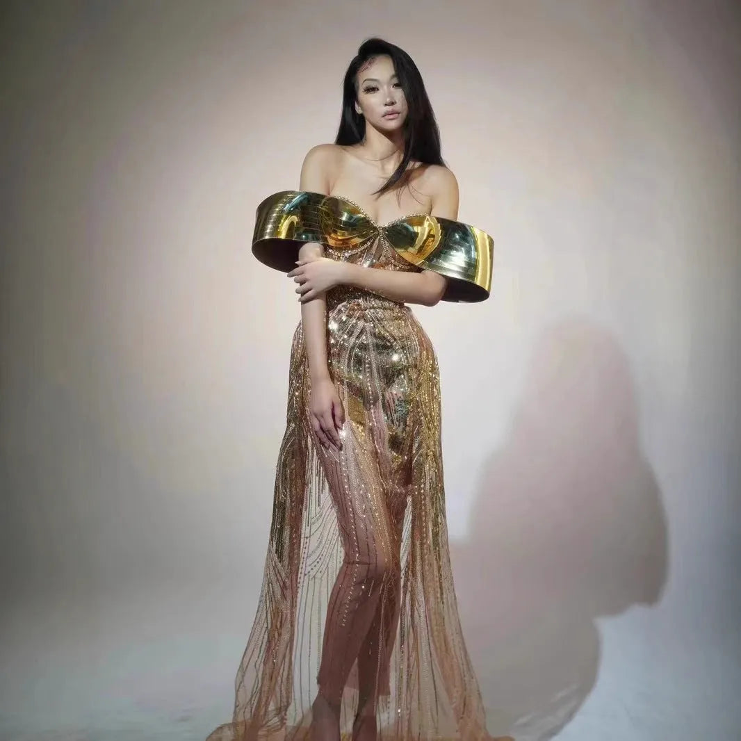 Gold sequined strapless evening dress with a thigh-high split in the long tulle skirt.