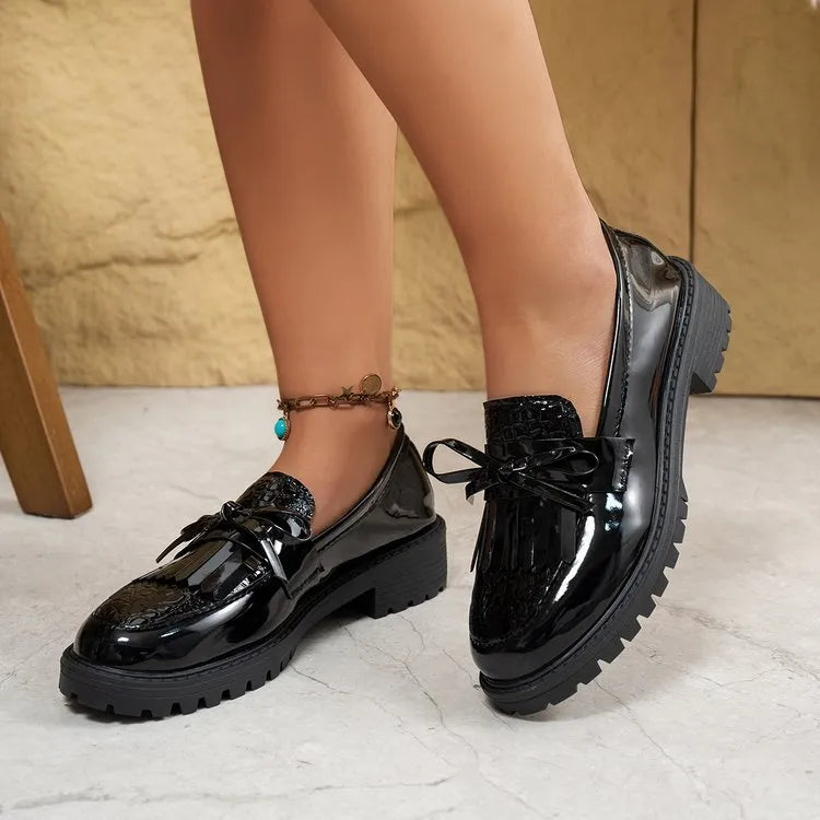 Women's black loafers with decorative bow detail for spring and autumn seasons