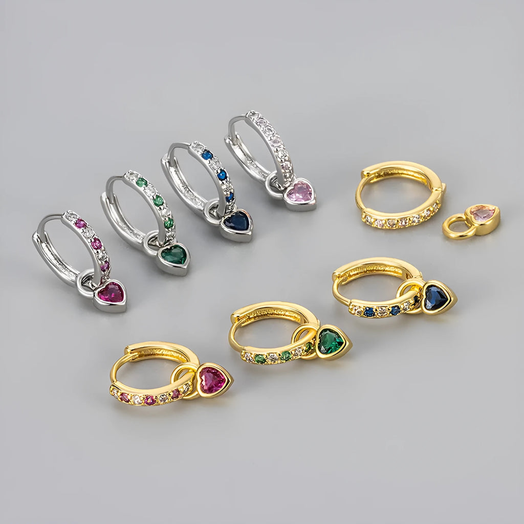 Heart-shaped ladies fashion earrings with coloured stone centrepiece and gold colour plating