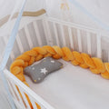 Braided knot baby crib bumper pillow in spandex velvet showing bendable design and colour options.