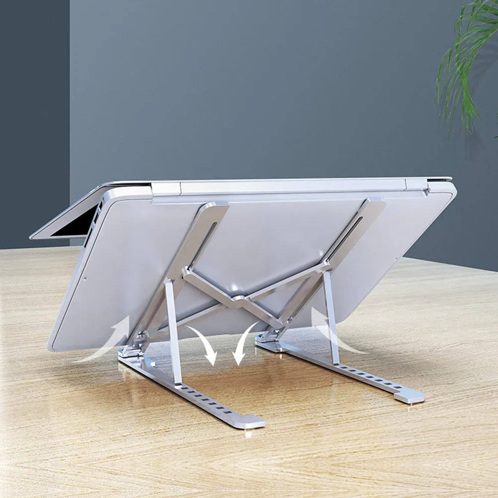 Foldable aluminium laptop stand in silver colour, shown in open and closed positions next to a laptop.