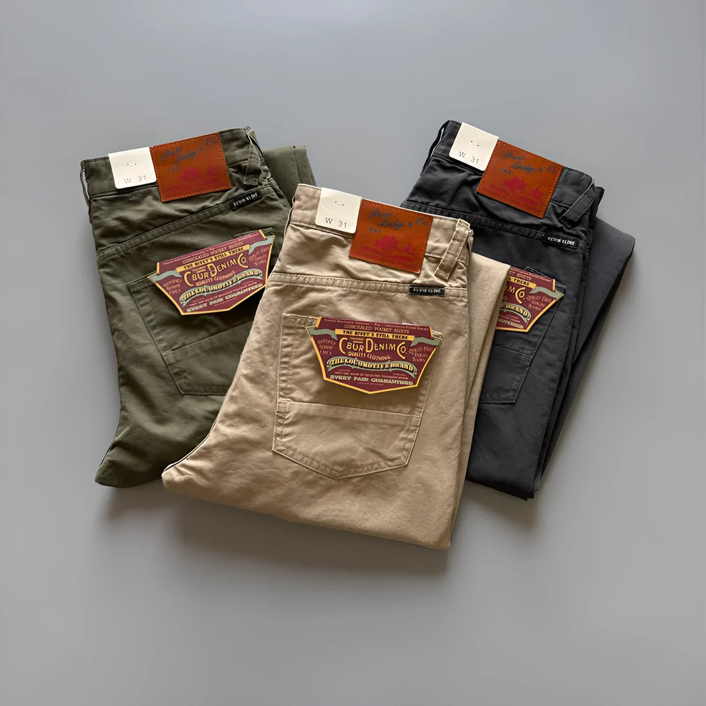 Men's grey cotton straight leg casual trousers laid flat showing mid waist and straight cut.