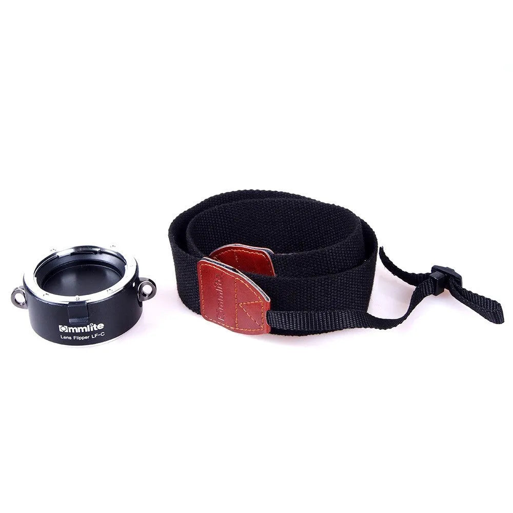 Aluminium alloy camera lens flipper holder with stainless steel buckle on a cotton shoulder strap.