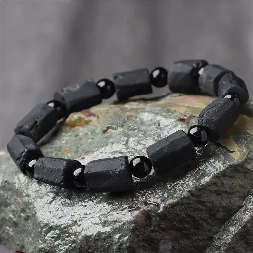 Natural black tourmaline rough stone bracelet with unpolished beads on wrist