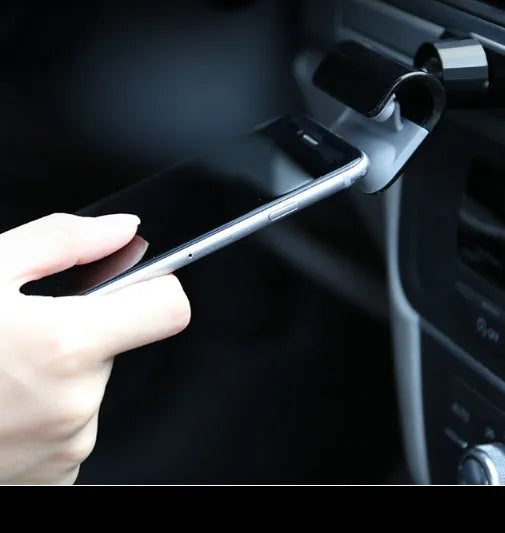 Black universal car phone holder showing 360-degree rotating mechanism and 3M adhesive base