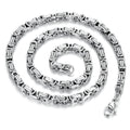 Stainless steel punk necklace with 5mm chain in steel finish on black background