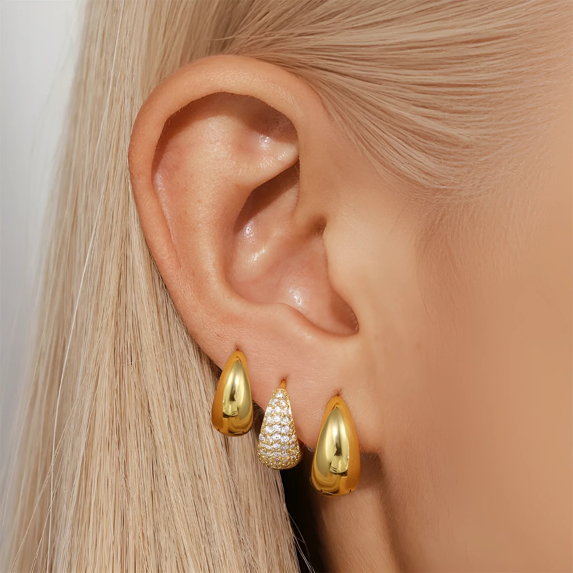 Gold electroplated brass diamond earclip earrings with geometric round design on copper base